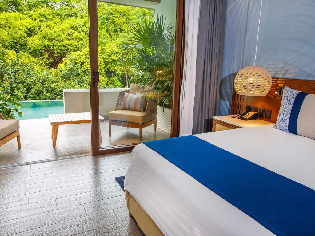 Postel nebo postele na pokoji v ubytování Armony Marival Resort & Spa Punta de Mita - MGallery collection