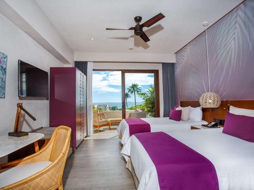Postel nebo postele na pokoji v ubytování Armony Marival Resort & Spa Punta de Mita - MGallery collection