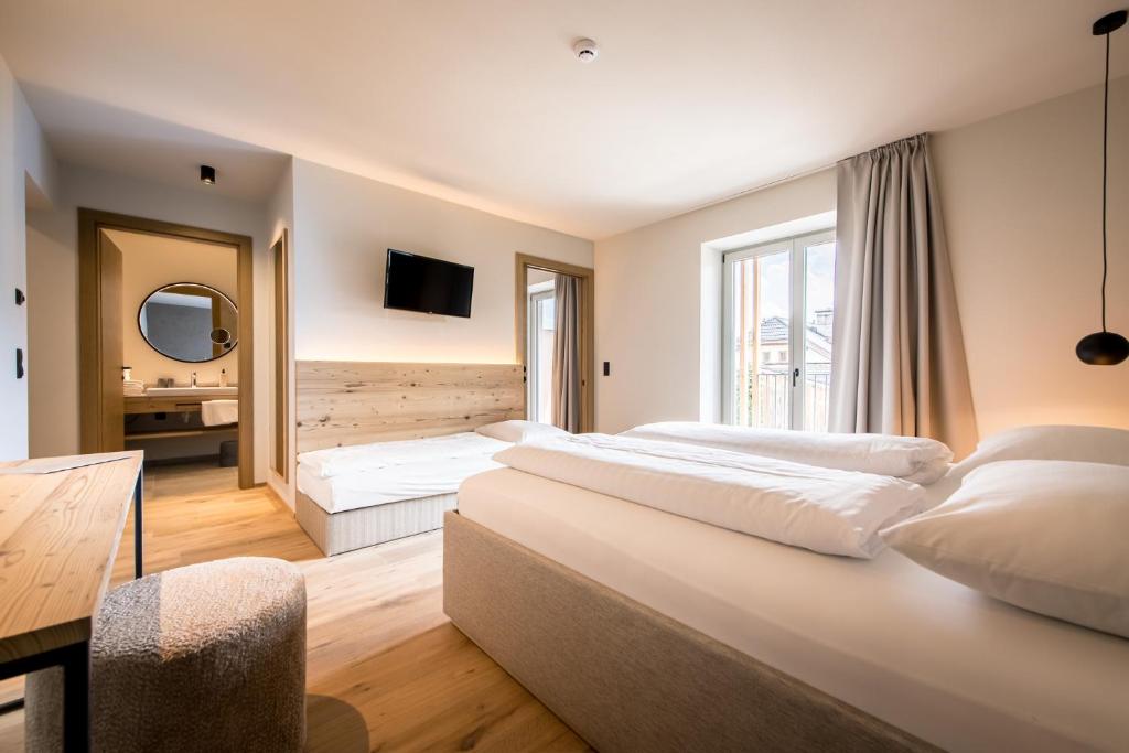 Posteľ alebo postele v izbe v ubytovaní Hotel Sonnenheim