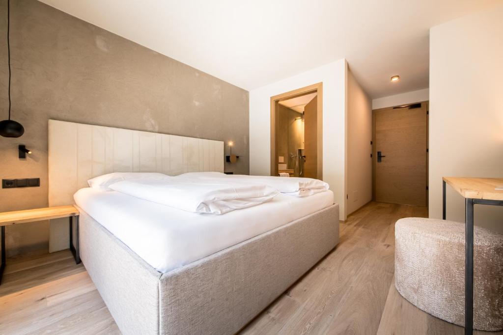 Posteľ alebo postele v izbe v ubytovaní Hotel Sonnenheim