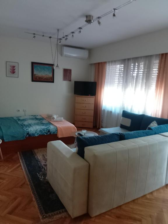 Postel nebo postele na pokoji v ubytování Fina Apartman