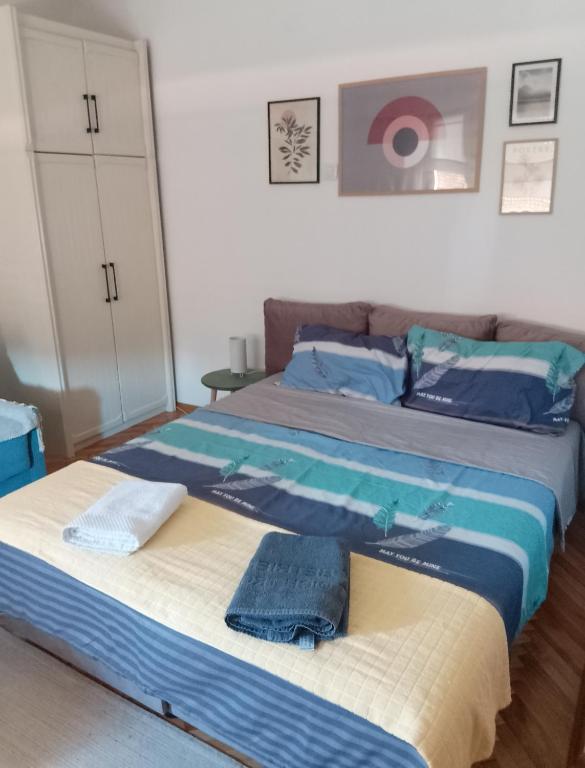 Postel nebo postele na pokoji v ubytování Fina Apartman
