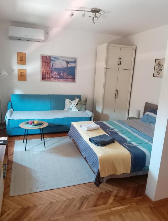 Postel nebo postele na pokoji v ubytování Fina Apartman