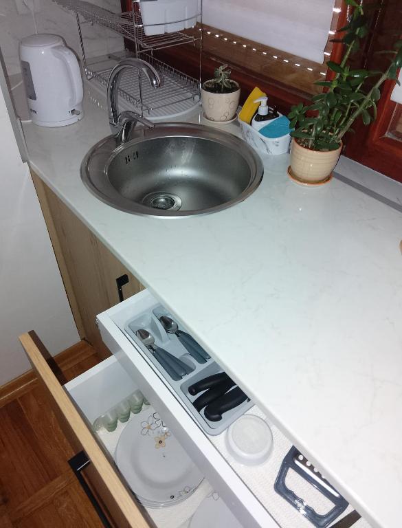 Kuchyň nebo kuchyňský kout v ubytování Fina Apartman