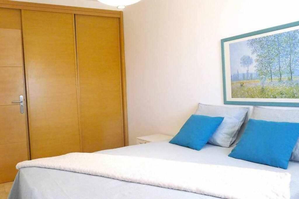 Łóżko lub łóżka w pokoju w obiekcie Villa Garoé