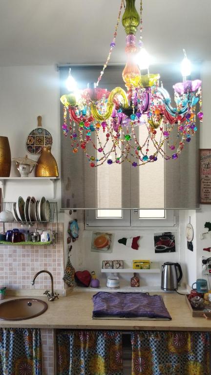 a kitchen with a chandelier hanging from the ceiling at OPEN SPACE in Augusta