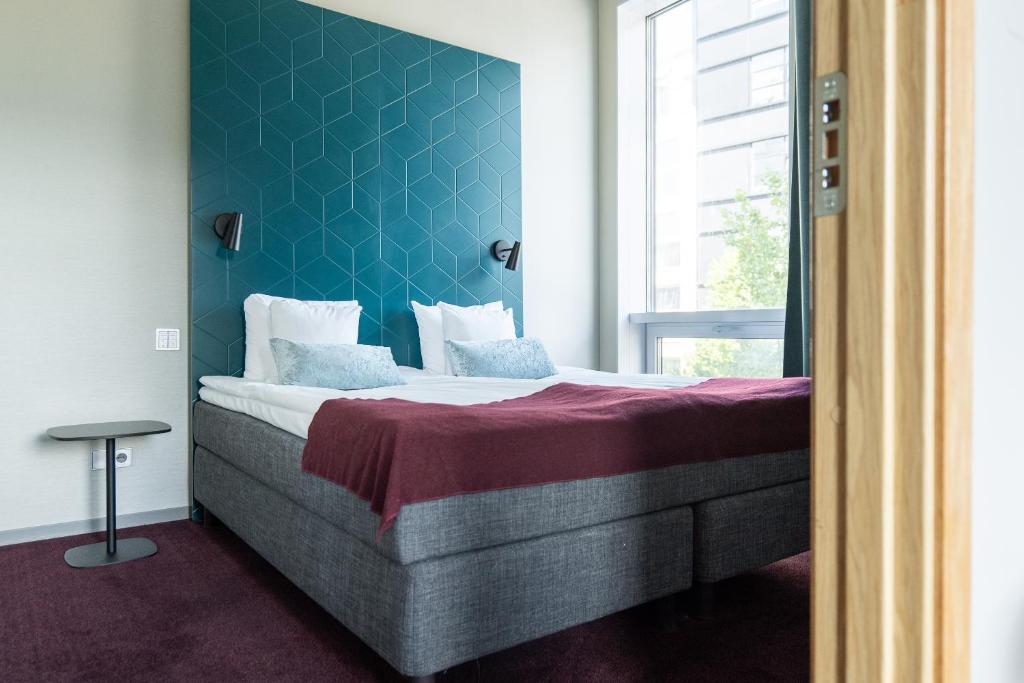 Ένα ή περισσότερα κρεβάτια σε δωμάτιο στο Apartments By Ligula, Hammarby Sjöstad