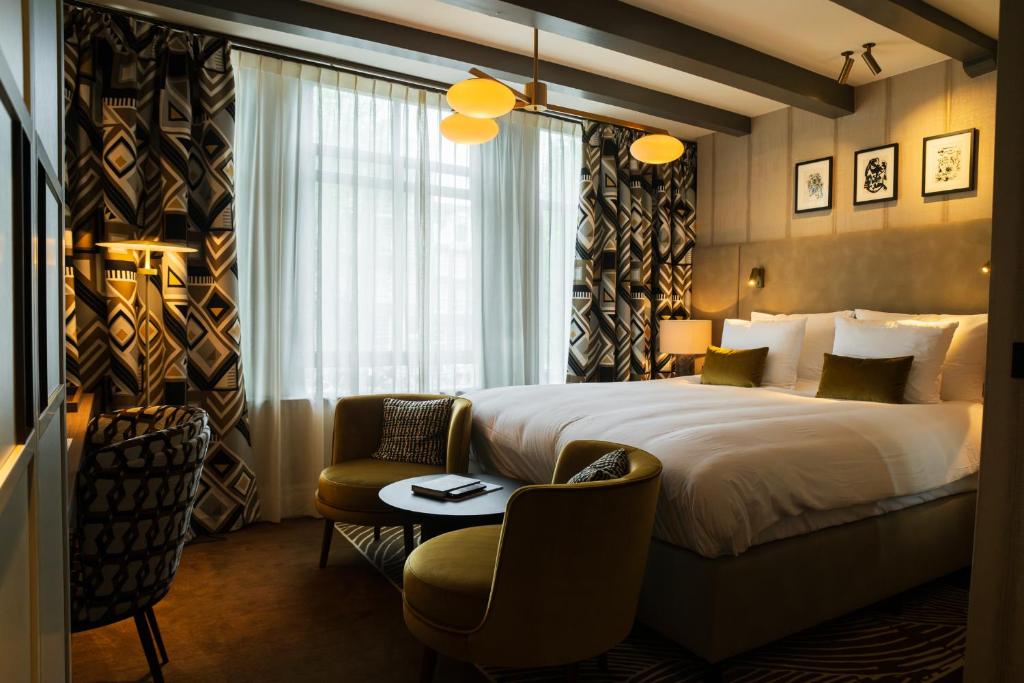 Postel nebo postele na pokoji v ubytování Ambassade Hotel