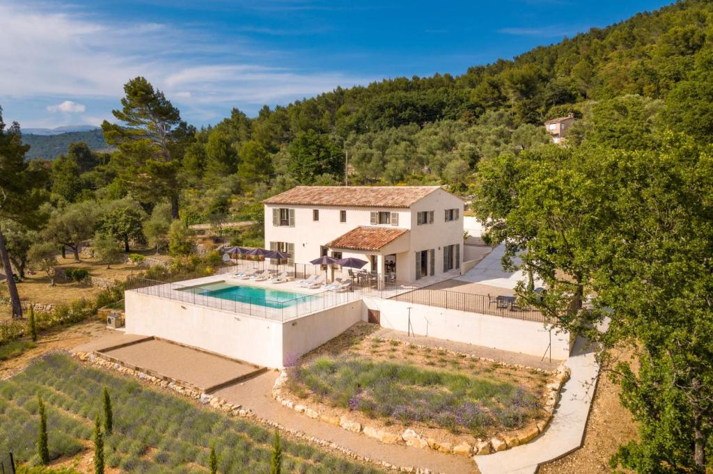 an aerial view of a house with a swimming pool at Villa Mas des Lavandes by Villa Plus in Le Tignet