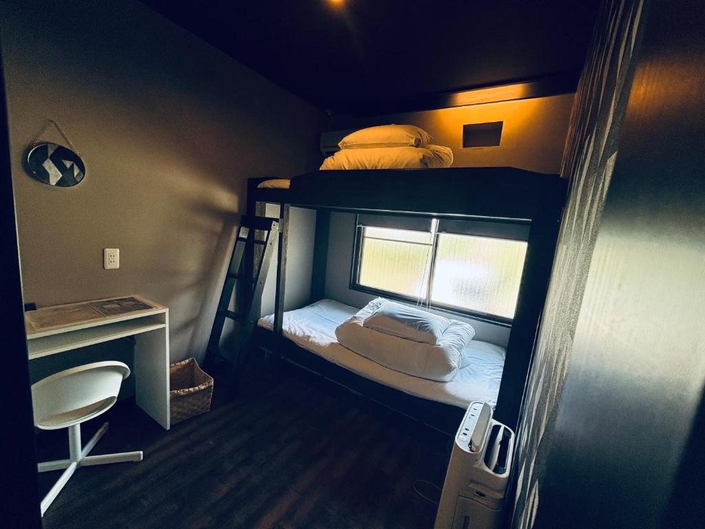 Postel nebo postele na pokoji v ubytování Hostel SAMURISE Mt Fuji