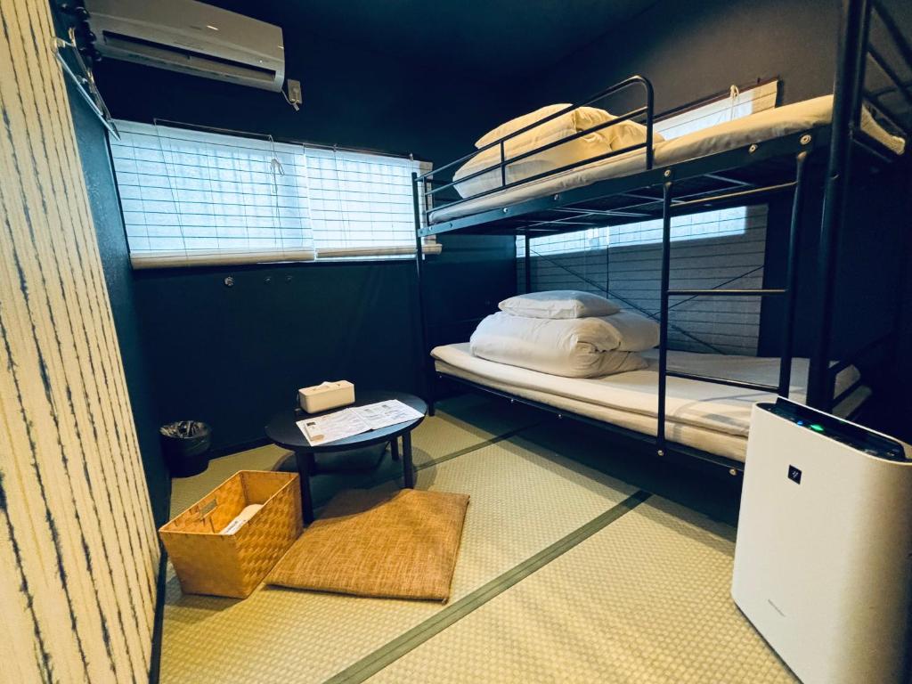 Postel nebo postele na pokoji v ubytování Hostel SAMURISE Mt Fuji