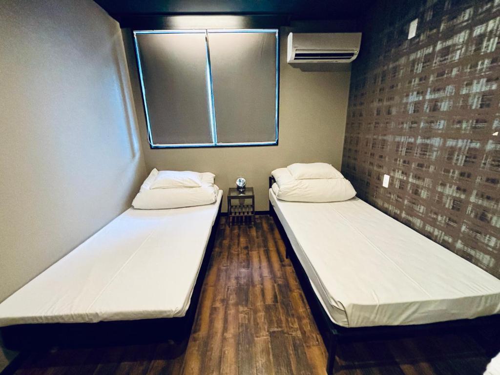 Postel nebo postele na pokoji v ubytování Hostel SAMURISE Mt Fuji