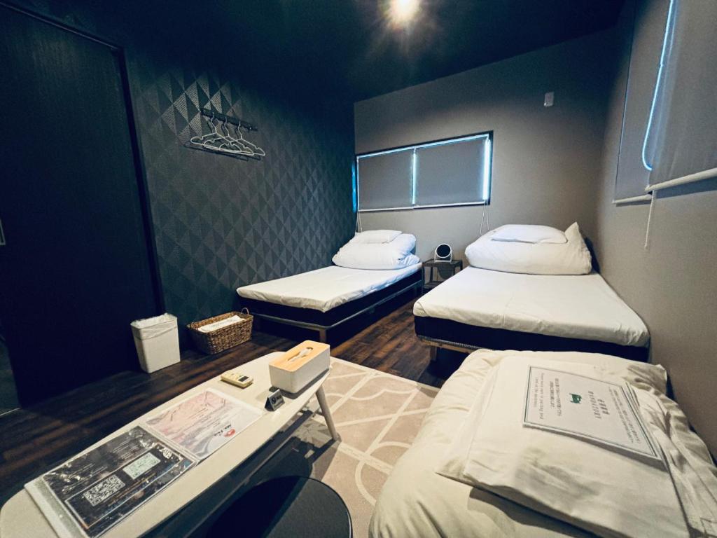 Postel nebo postele na pokoji v ubytování Hostel SAMURISE Mt Fuji