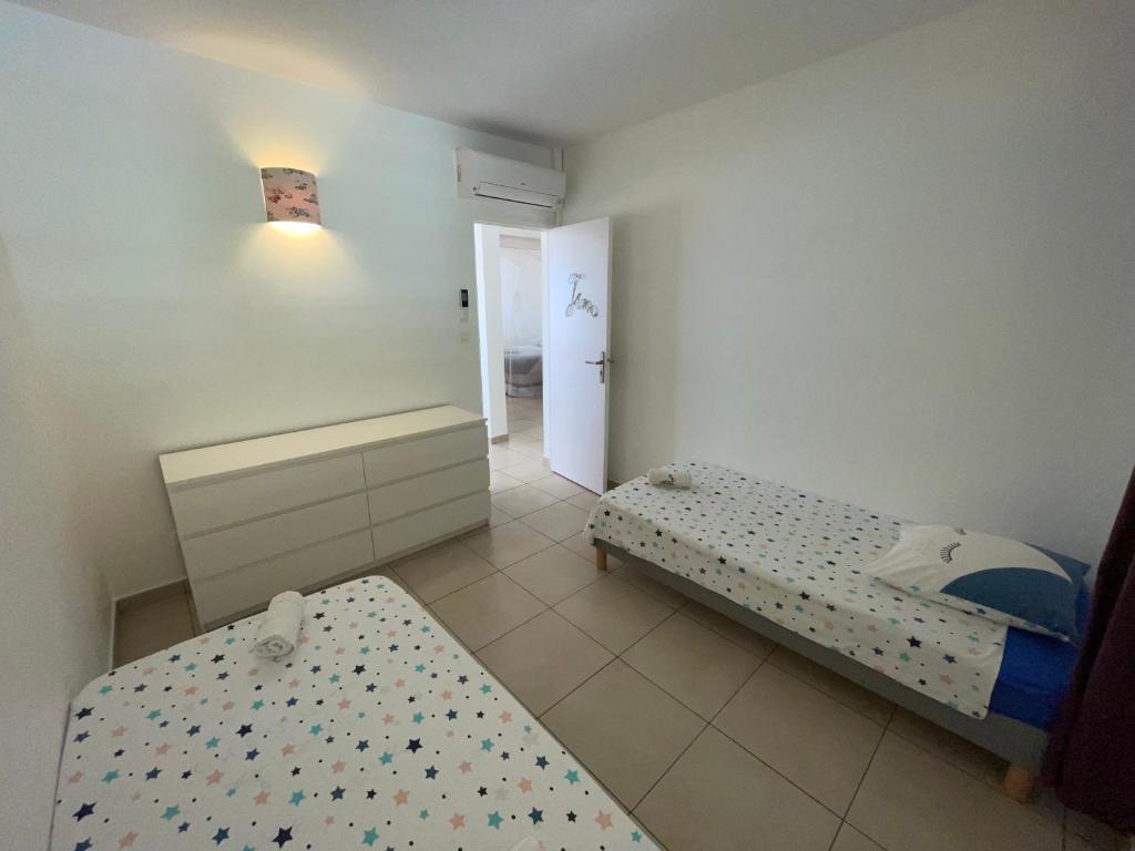 Postel nebo postele na pokoji v ubytování Martinique Villa Escale Diamant