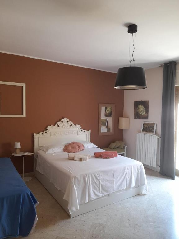 Postel nebo postele na pokoji v ubytování B&B famigliare Arcadia Polignano