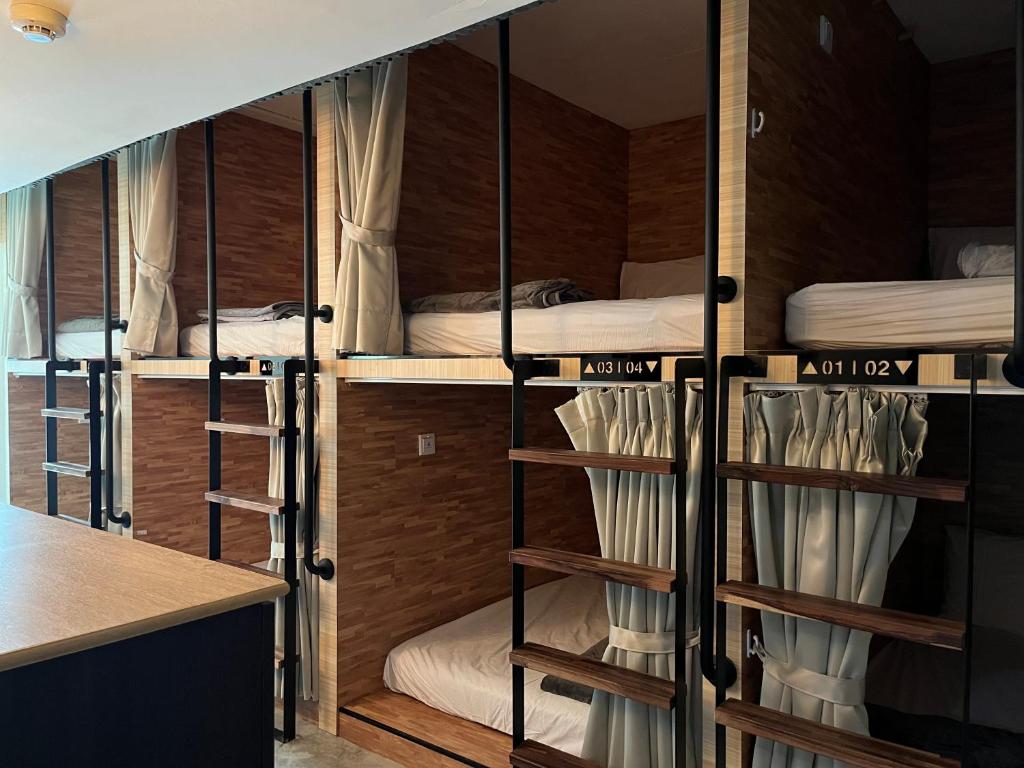 A bed or beds in a room at NK Hostel