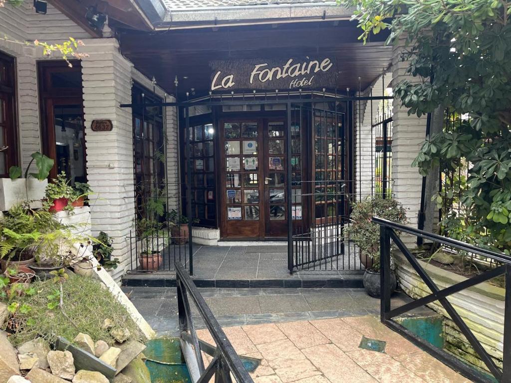 a store front of a building with the door open at Hotel La Fontaine in La Lucila del Mar