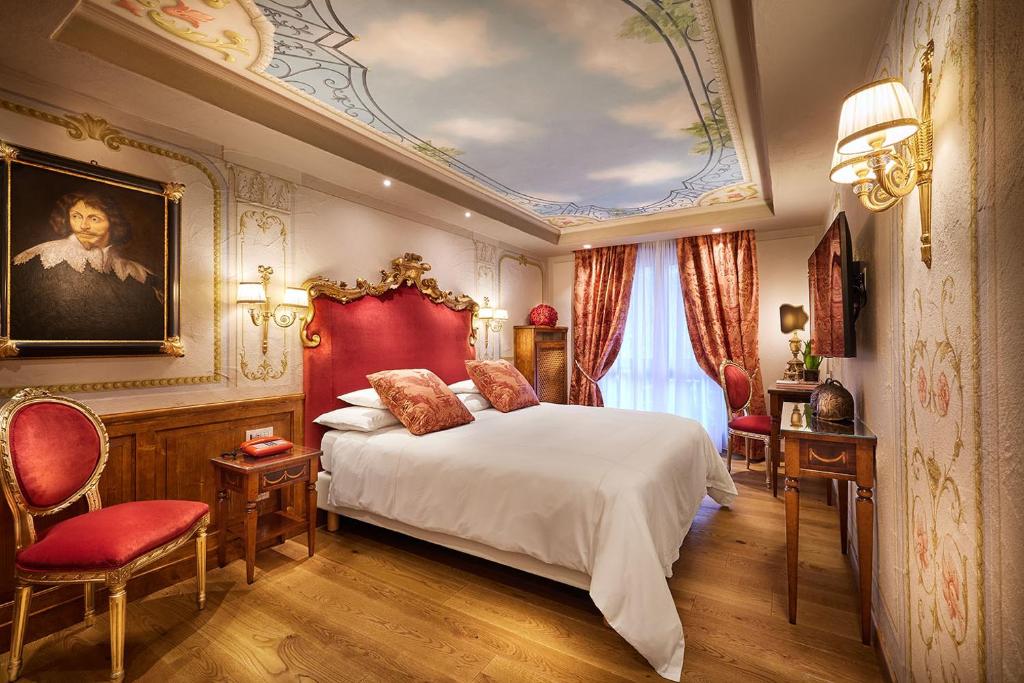 Postel nebo postele na pokoji v ubytování Hotel Miramonti