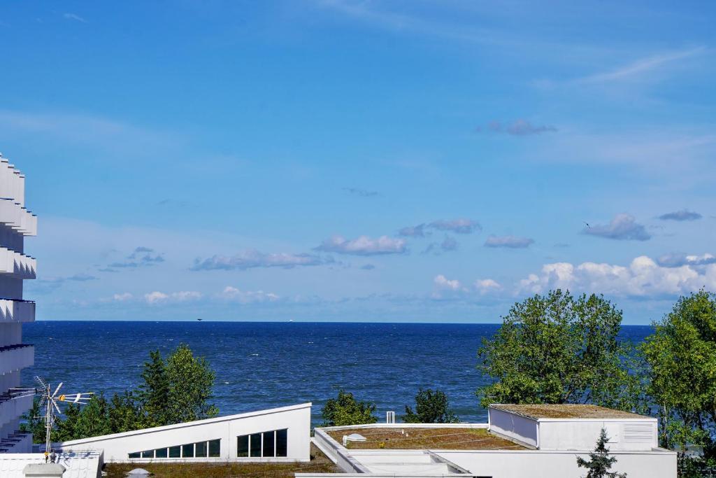 a view of the ocean from a building at Horyzont by Baltic Home in Międzyzdroje