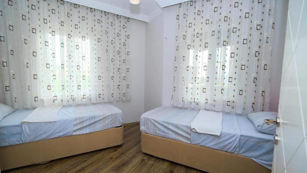 Postel nebo postele na pokoji v ubytování VillaYL
