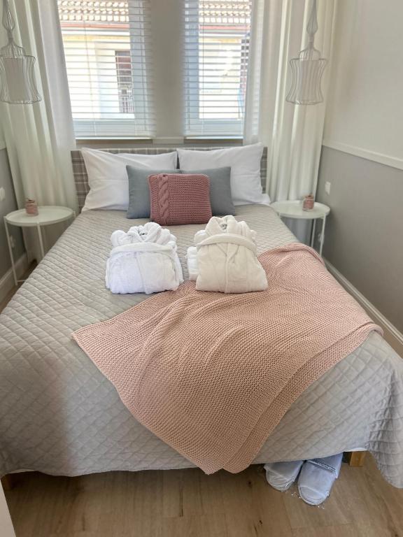 Posteľ alebo postele v izbe v ubytovaní ForCity Apartment