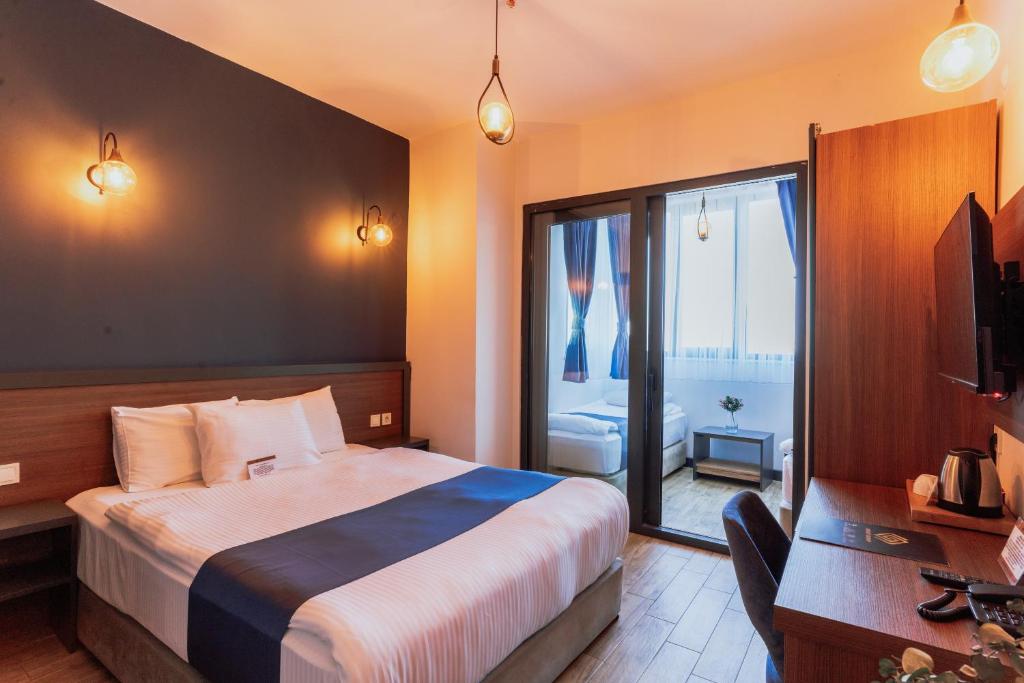 Postel nebo postele na pokoji v ubytování The Rest Port Hotel