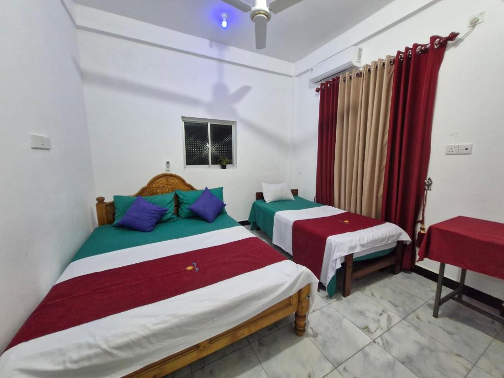 Postel nebo postele na pokoji v ubytování TRINCO VISTARA GUEST House