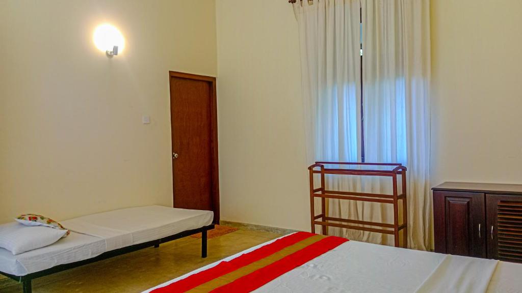 Postel nebo postele na pokoji v ubytování Sigiri Lanka Resort
