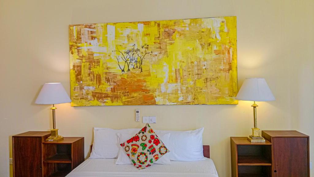 Postel nebo postele na pokoji v ubytování Sigiri Lanka Resort
