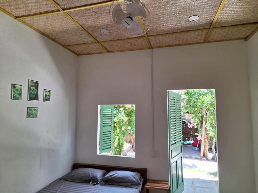 Postel nebo postele na pokoji v ubytování Homestay Dat Phu