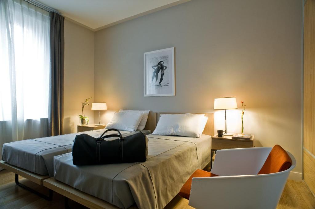 Postel nebo postele na pokoji v ubytování Escalus Luxury Suites Verona