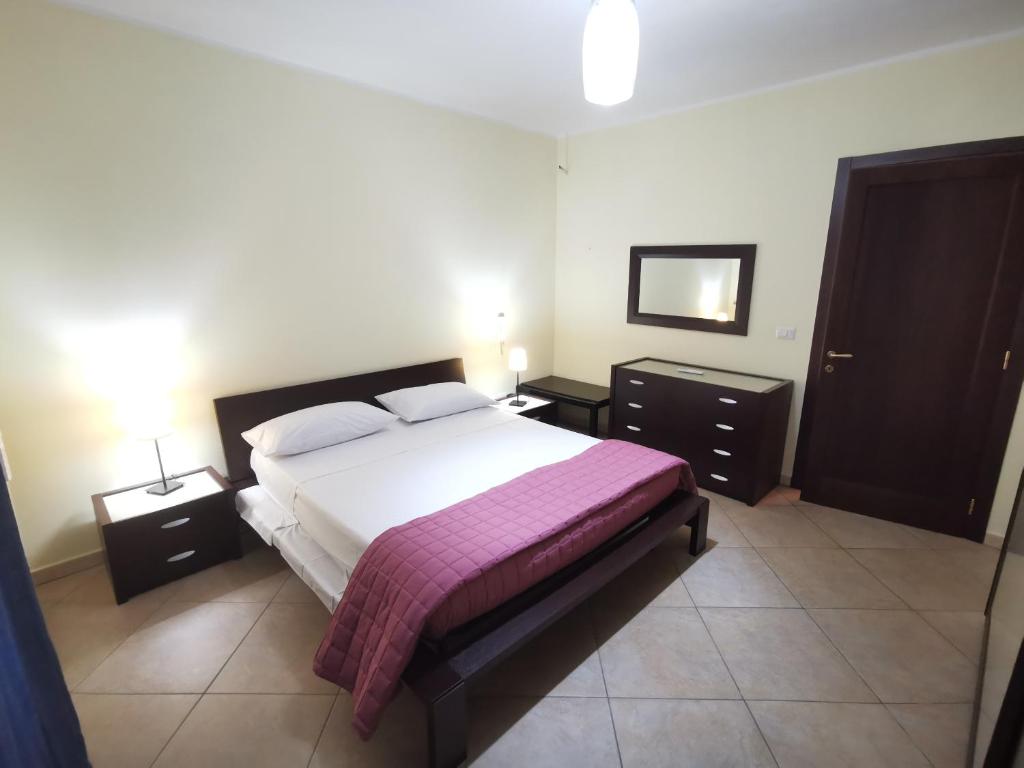 Postel nebo postele na pokoji v ubytování Casa Vitina