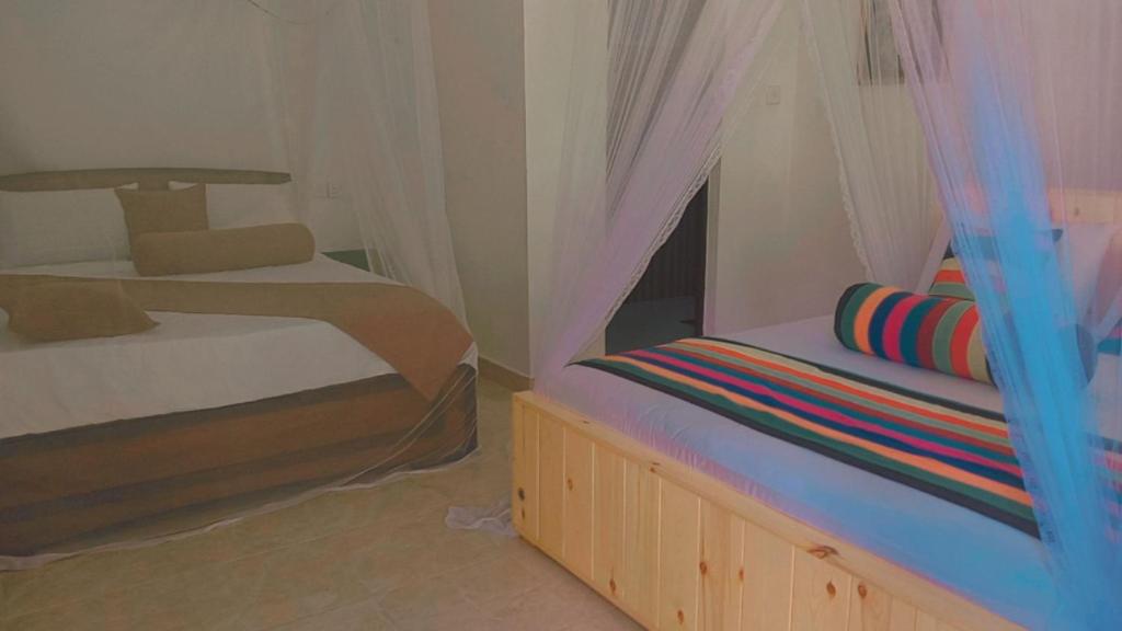 Postel nebo postele na pokoji v ubytování Serenity Homestay