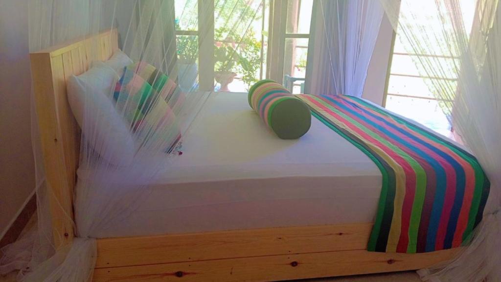 Postel nebo postele na pokoji v ubytování Serenity Homestay