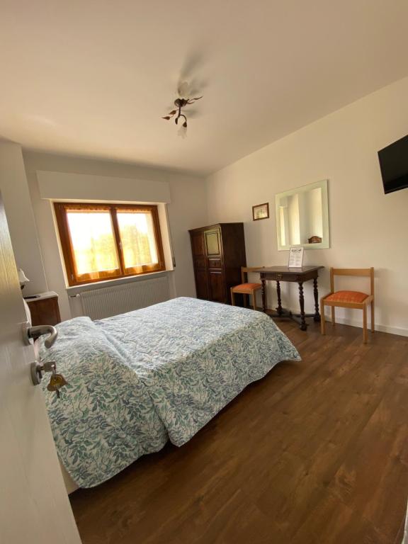 Łóżko lub łóżka w pokoju w obiekcie B&B Panorama Dolomiti