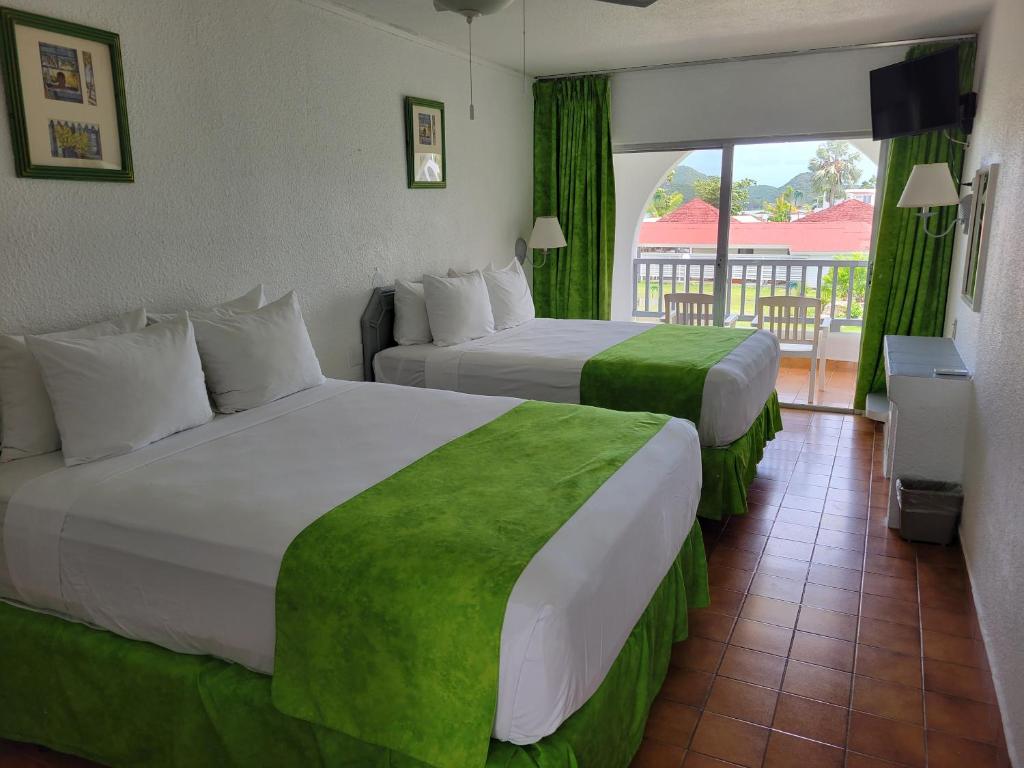 Postel nebo postele na pokoji v ubytování Jolly Beach Antigua - All Inclusive