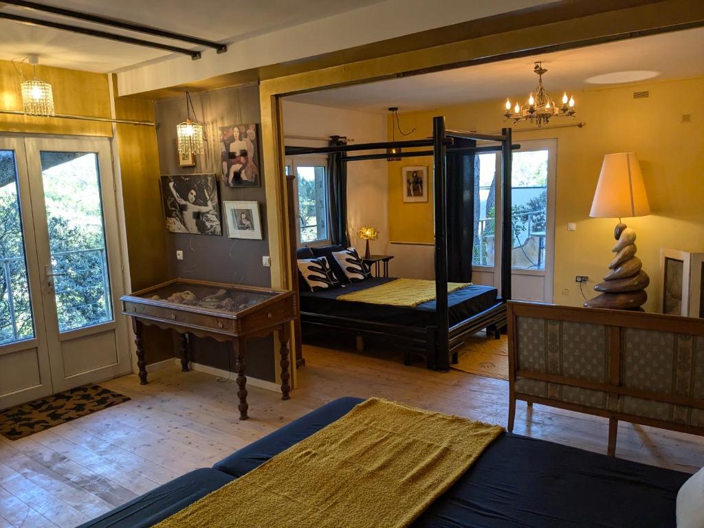 a room with two beds and a mirror at Charme, vue et piscine naturelle in Vedène