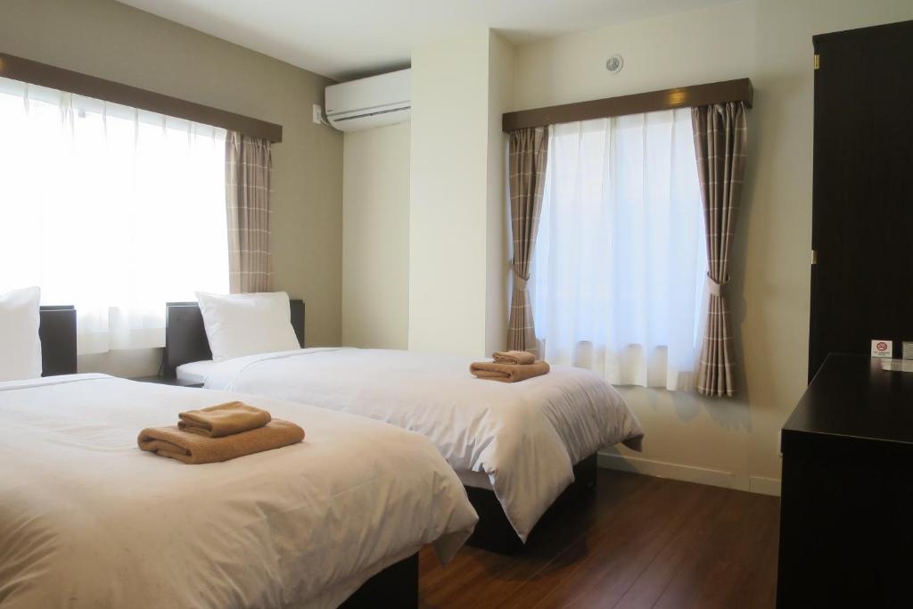 Postel nebo postele na pokoji v ubytování Hotel Imalle Haneda