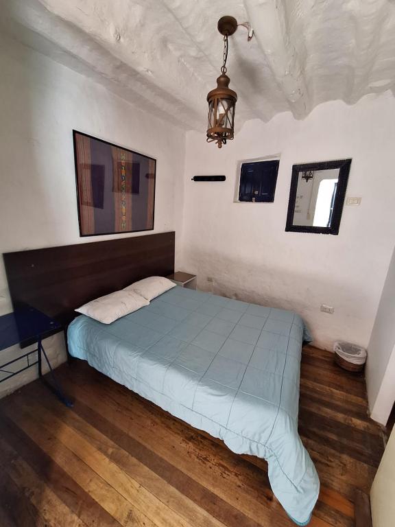 Letto o letti in una camera di Intro Hostels Cusco