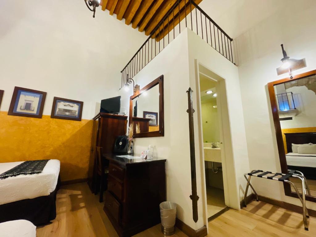 Postel nebo postele na pokoji v ubytování Hotel Historia