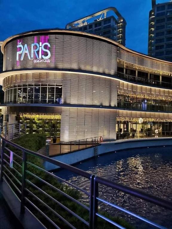 a large building with a sign on the side of it at Manila Urban Resort at Azure in Manila