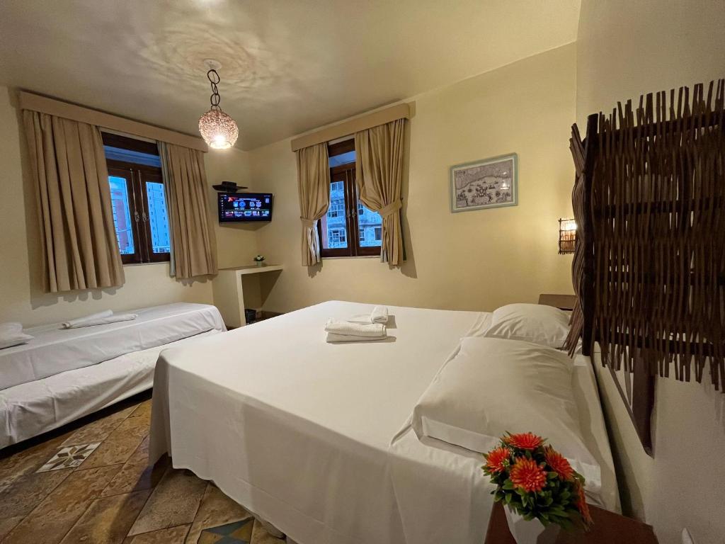 Postel nebo postele na pokoji v ubytování Pousada Fortal Villa Praia