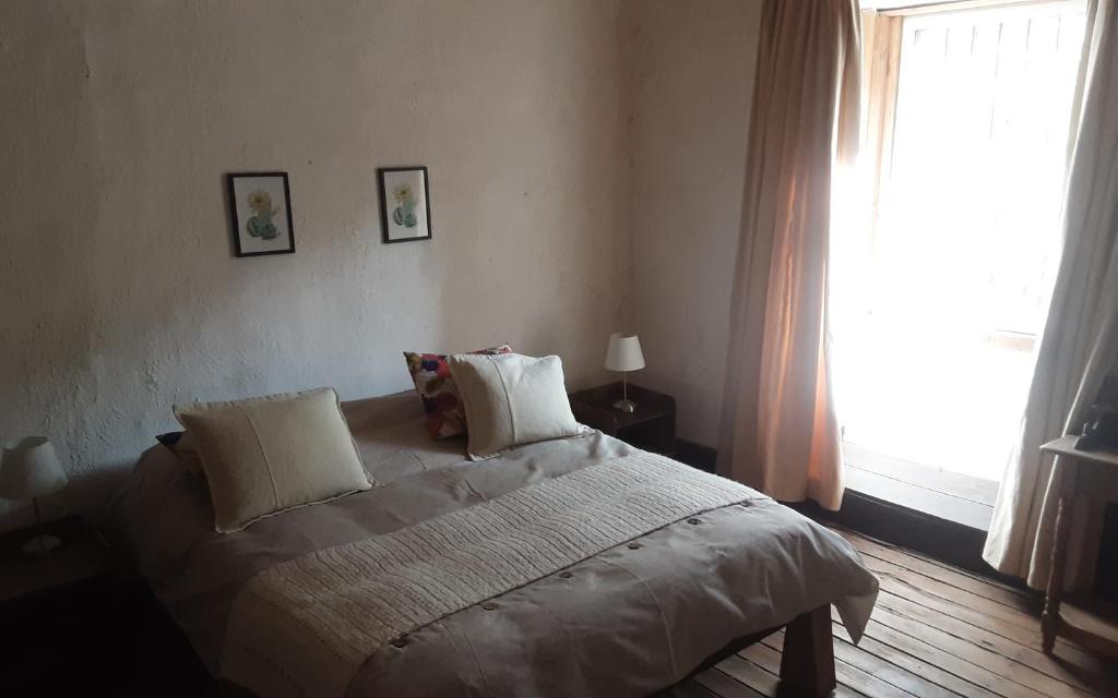 Postel nebo postele na pokoji v ubytování Casa Gabriela, Monte Grande ,Valle de Elqui