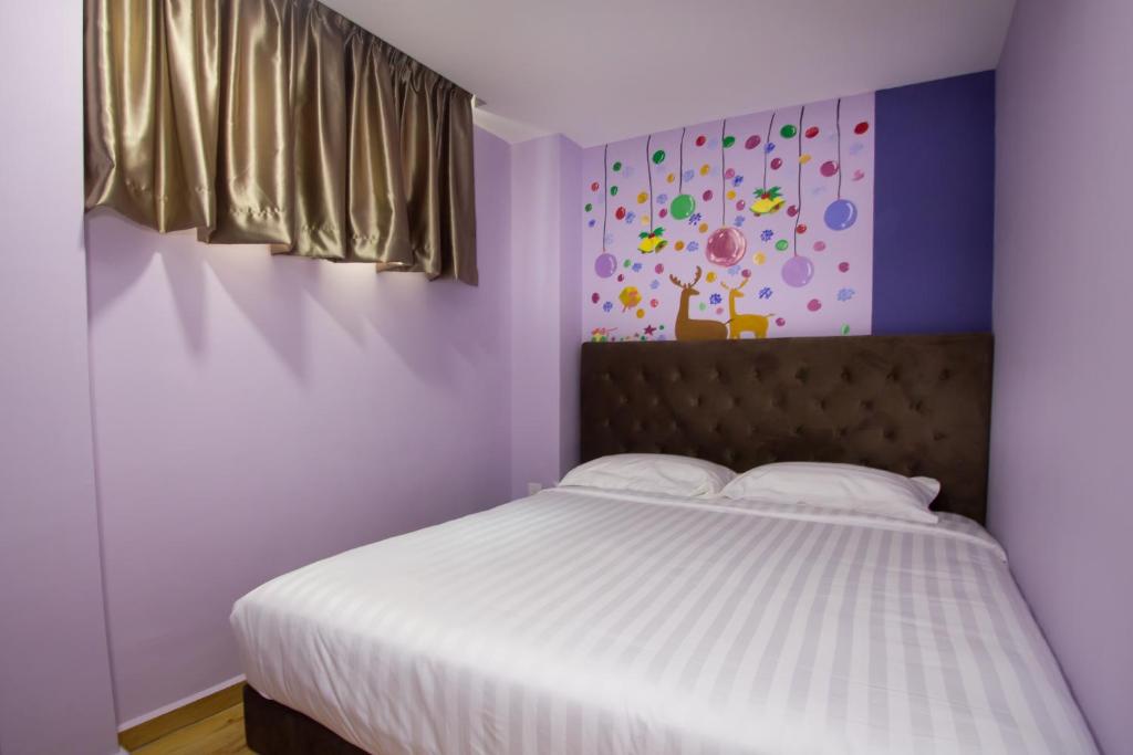 Postel nebo postele na pokoji v ubytování Elmark Hotel Johor