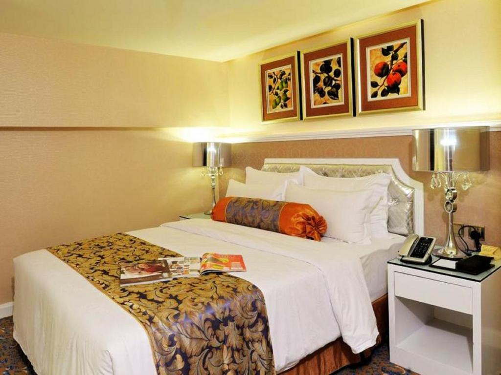Postel nebo postele na pokoji v ubytování Hotel Metropole