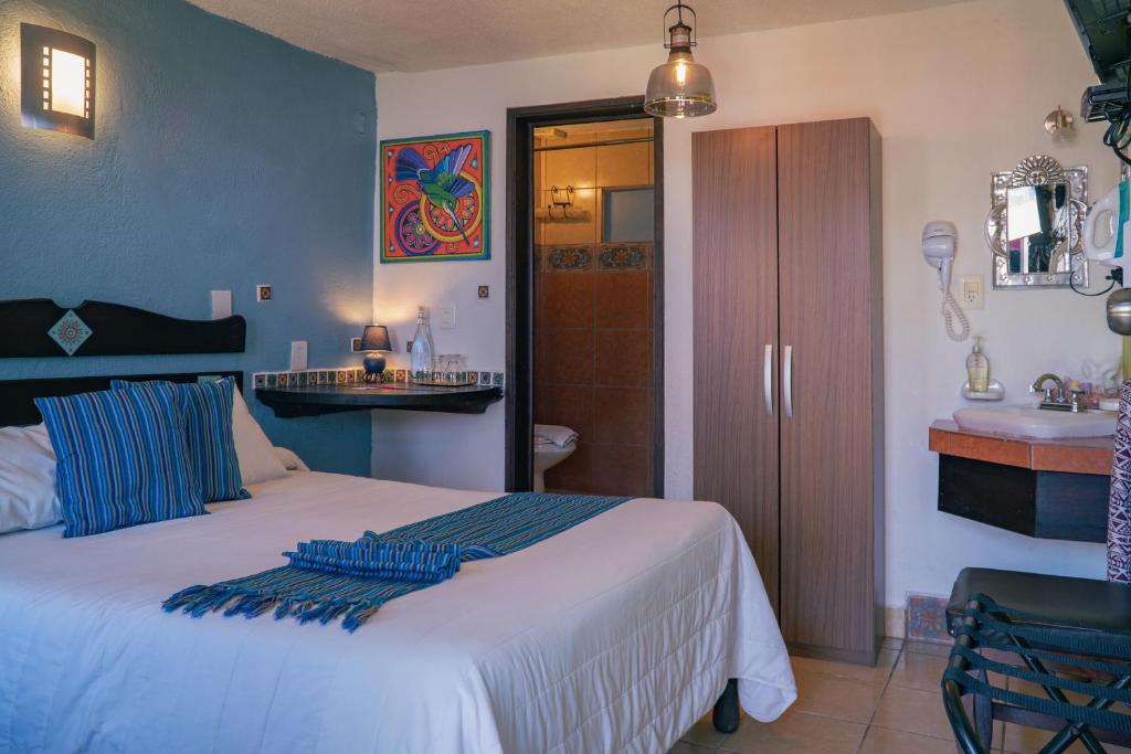 Postel nebo postele na pokoji v ubytování Hotel Tepeyac