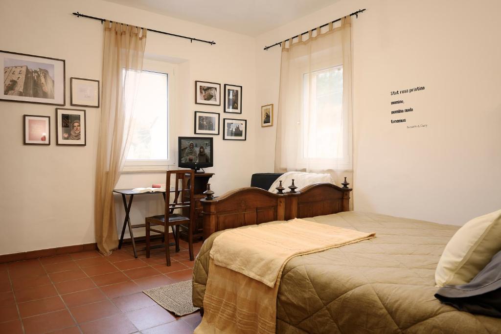 TV a/nebo společenská místnost v ubytování B&B Il Bed and Bookfast