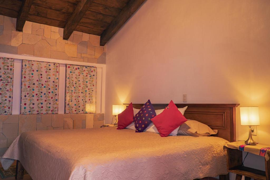 Postel nebo postele na pokoji v ubytování Hotel Tepeyac