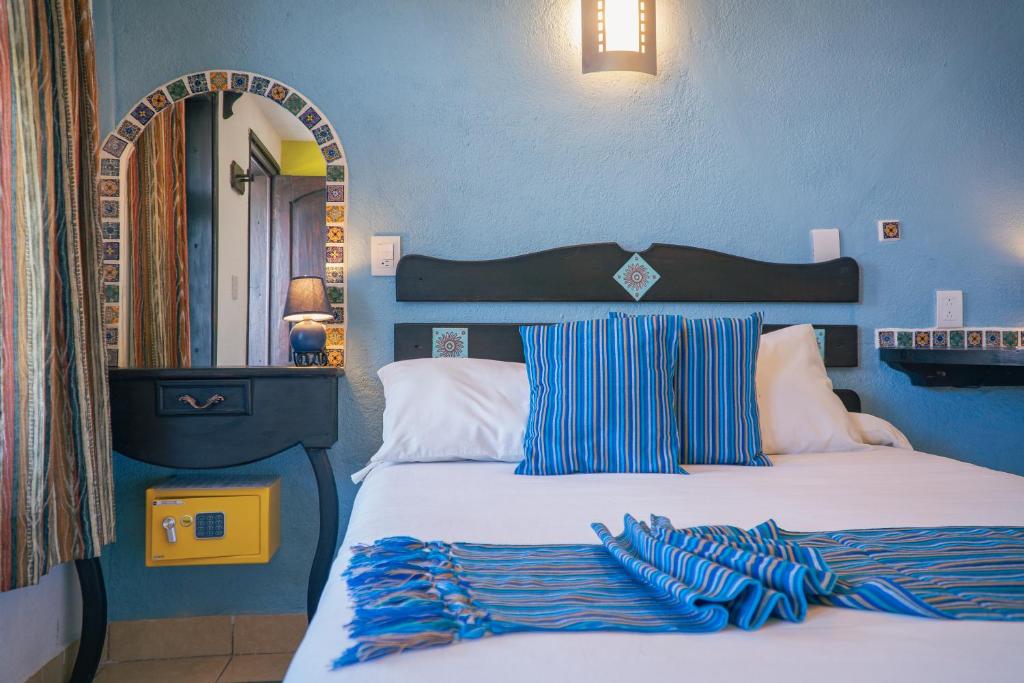 Postel nebo postele na pokoji v ubytování Hotel Tepeyac