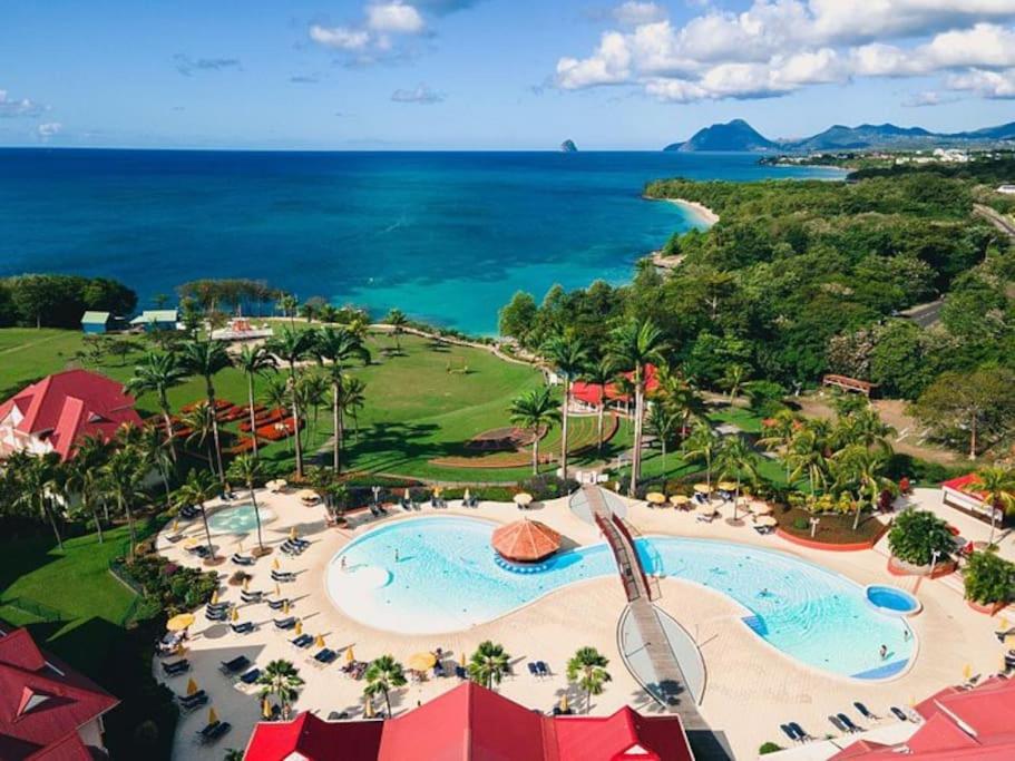 an aerial view of a resort with a pool and the ocean at NEW ! 3 pièces avec piscine et plage accessibles à pieds in Sainte-Luce